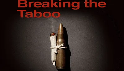 Cartel de Breaking the Taboo con un cigarrillo encendido atado a una bala mediante un cordel, sobre fondo oscuro. Cartel de Breaking the Taboo con un cigarrillo encendido atado a una bala mediante un cordel, sobre fondo oscuro.