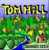 Logotipo de Tom Hill con grandes letras amarillas sobre un paisaje ilustrado de árboles, montañas y un río azul. Logotipo de Tom Hill con grandes letras amarillas sobre un paisaje ilustrado de árboles, montañas y un río azul.