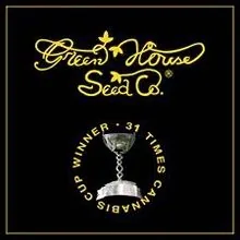 Logotipo dorado de Green House Seed Co. sobre fondo negro, con un trofeo y el texto «Winner · 31 times Cannabis Cup».