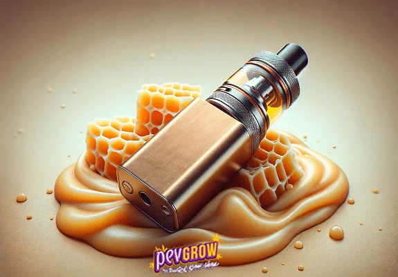 Vapeador dorado inclinado sobre una base cremosa con formas de panal y gotas alrededor, sobre fondo beige.