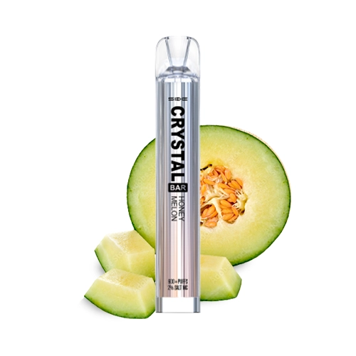 Vapeador Crystal Bar Honey Melon de SKE, con cuerpo plateado y boquilla transparente, delante de medio melón y trozos sobre fondo blanco.