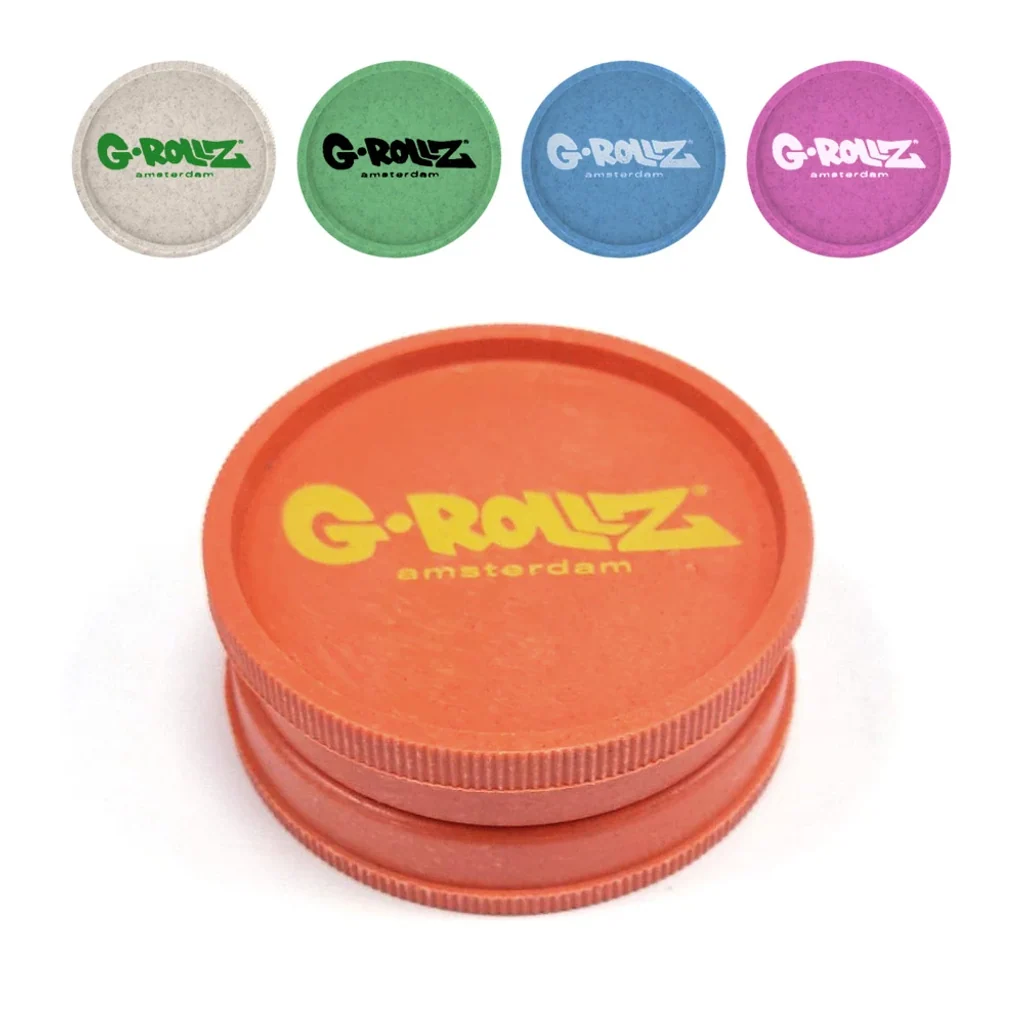 Grinder G-Rollz naranja en primer plano y selección de colores beige, verde, azul y rosa en la parte superior, sobre fondo blanco.