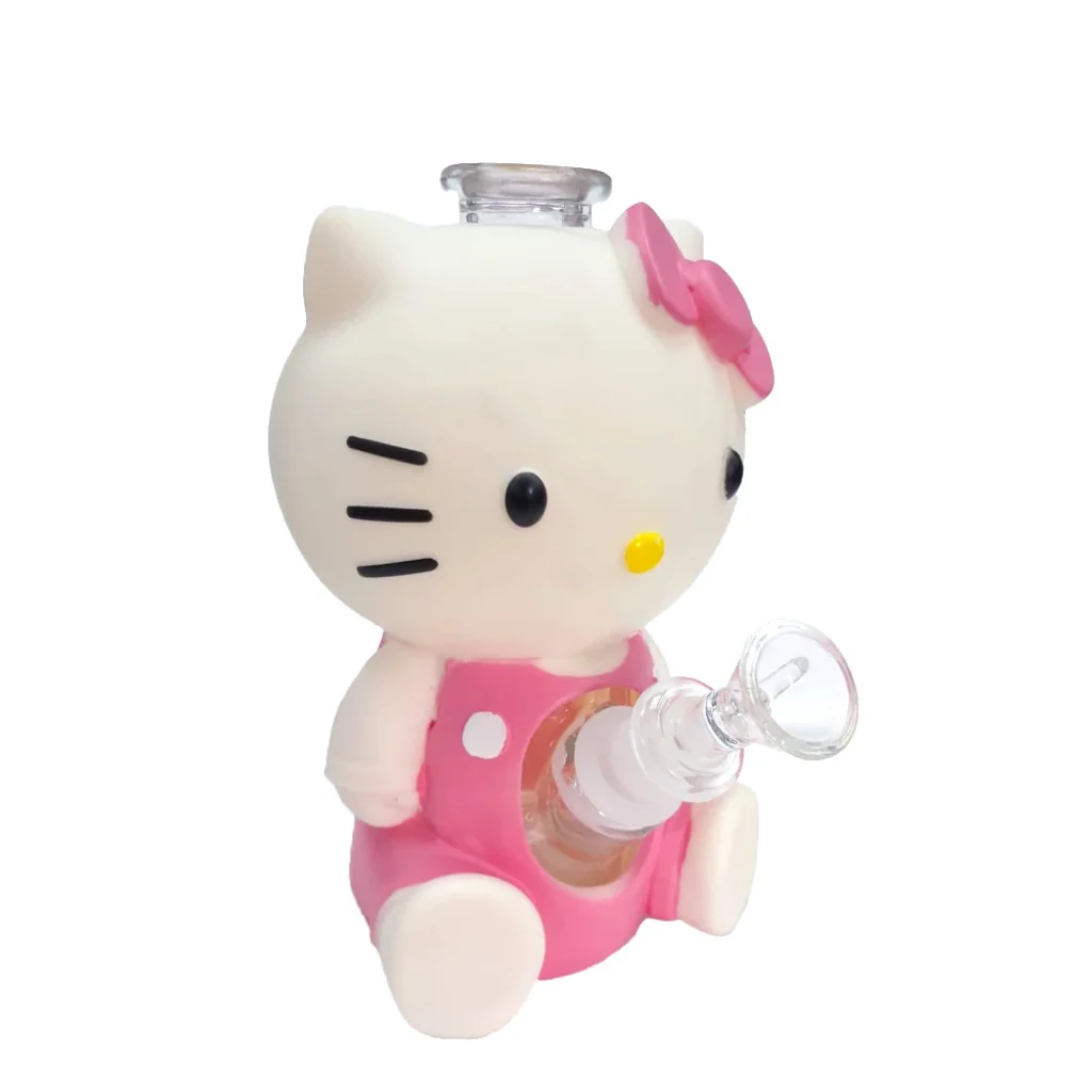Bong con forma de Hello Kitty, cuerpo blanco, vestido y lazo rosas, abertura superior transparente y cazoleta frontal de vidrio.