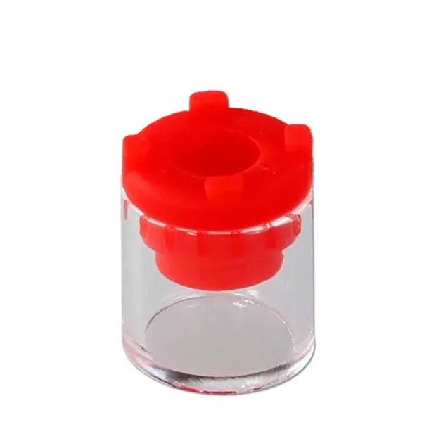 Depósito transparente Fenix Mini para concentrados y wax, de forma cilíndrica con pieza superior roja y abertura central.