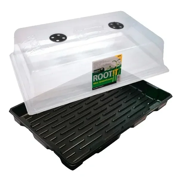 Propagador Rootit con tapa transparente elevada, respiraderos negros y bandeja oscura con relieves alargados.