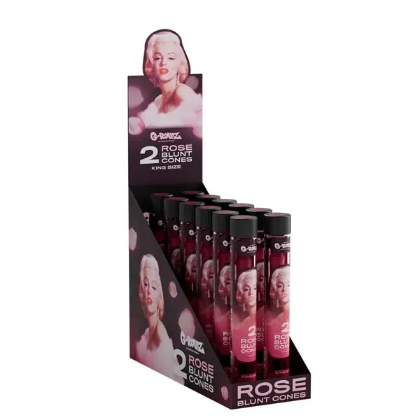 Expositor G-Rollz Rose Blunt Cones con tubos de tapón negro y retratos de Marilyn; el cartel indica dos conos King Size.