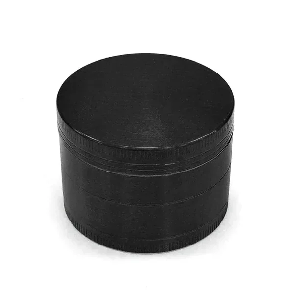 Grinder negro cilíndrico cerrado, visto en perspectiva, con tapa lisa, bordes estriados y líneas de separación entre secciones.