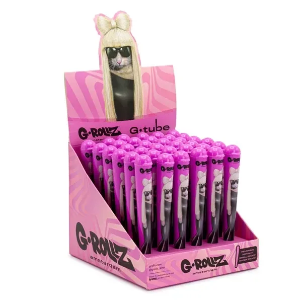 Expositor rosa G-Rollz G-tube con varios portacigarros de tapón rosa e ilustración de un personaje con pelo rubio y gafas oscuras.