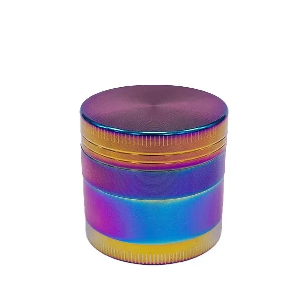 Grinder Rainbow cerrado, de forma cilíndrica y acabado multicolor, con tapa violeta y bordes dorados estriados sobre fondo blanco.
