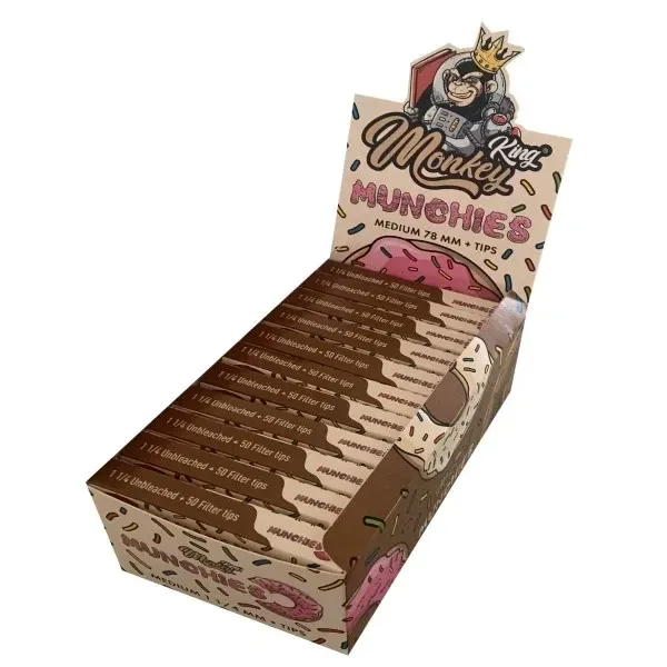 Expositor de papel y tips Monkey King Munchies con varias libretas marrones y beige, dibujos de dónuts y un simio coronado.