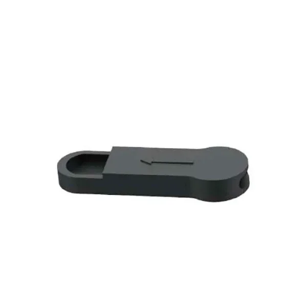 Pieza Air Flow para X-vape X-max Fog, negra y alargada, con una abertura ovalada, una flecha en relieve y un orificio lateral sobre fondo blanco.