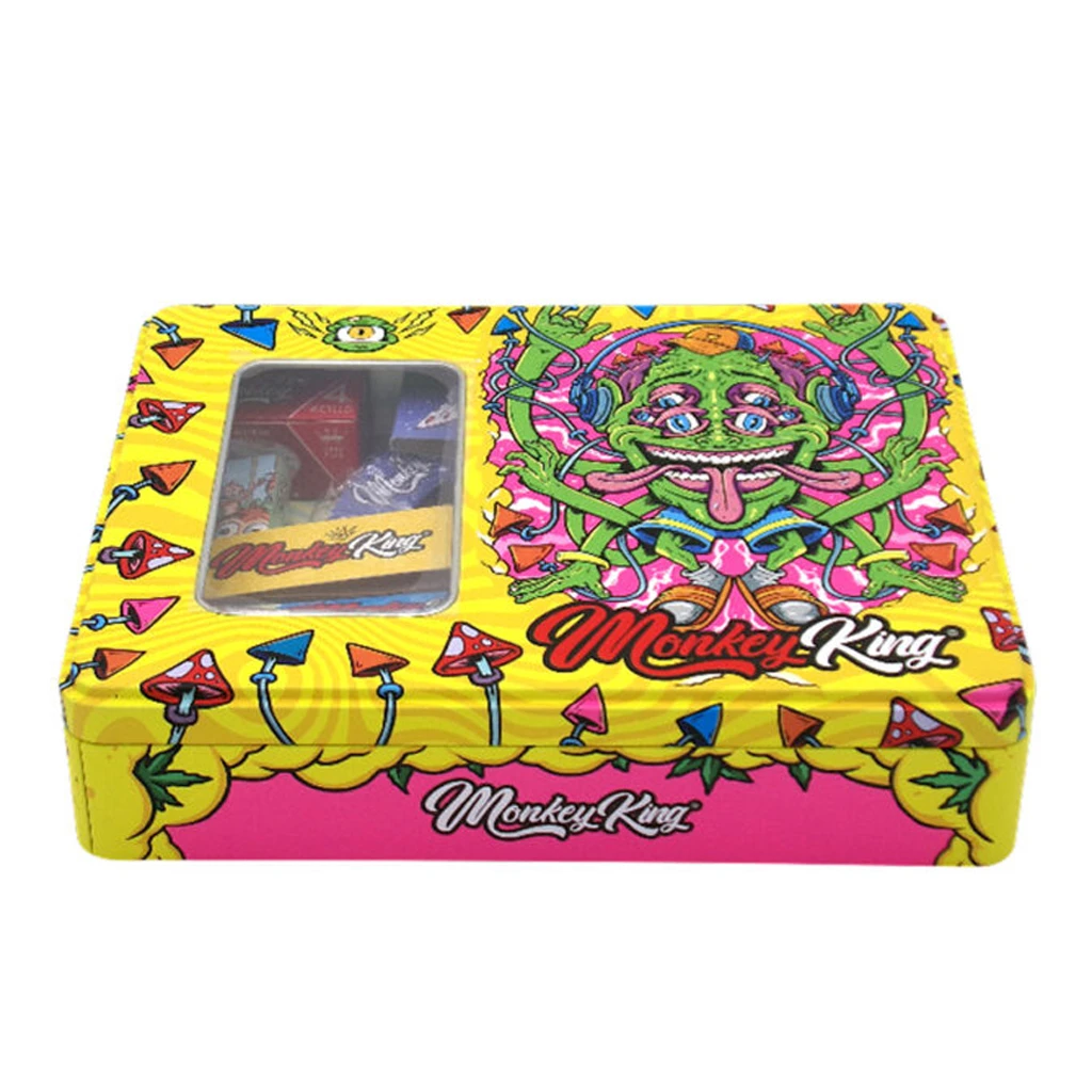 Caja amarilla Monkey King Try Kit con ventana en la tapa y dibujos multicolores de setas y un personaje verde con varios ojos.