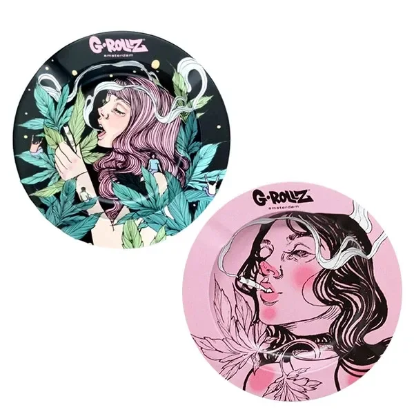 Ceniceros redondos G-Rollz en diseños negro y rosa, con ilustraciones de mujeres, hojas de cannabis y volutas de humo.