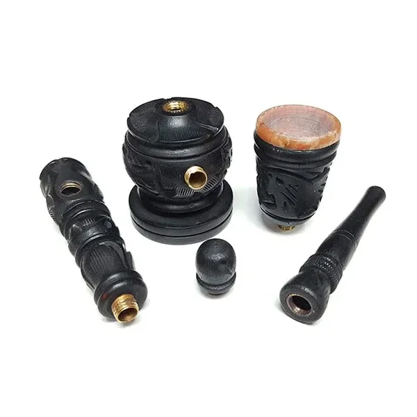 Pipa Madera Convertible XS desmontada, con piezas negras talladas, conexiones doradas y una cazoleta de borde marrón sobre fondo blanco.