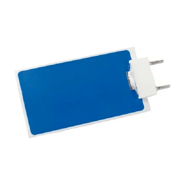 Placa de repuesto Indizono rectangular, con superficie azul, borde blanco y dos terminales metálicos en un extremo, sobre fondo blanco.
