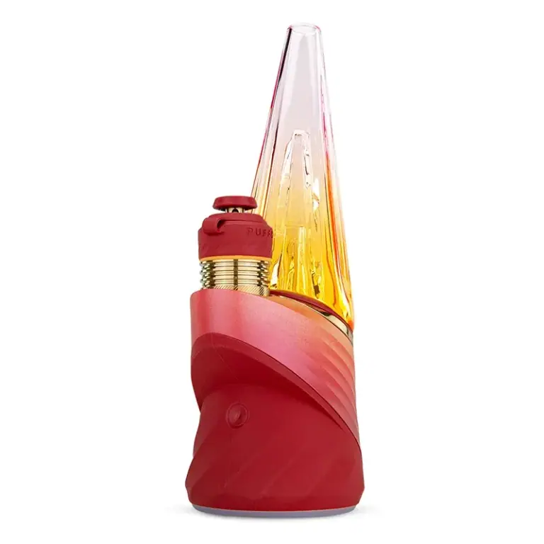 Vaporizador Puffco Peak Pro 3DXL Red con base roja de relieves curvos, botón frontal y pieza cónica transparente de tonos amarillo y rosa.