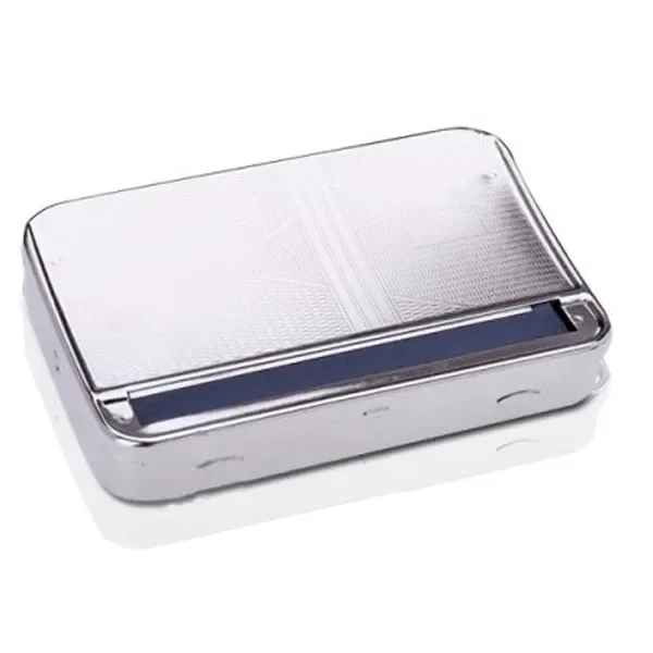 Liadora de caja metálica King Size Champ, rectangular y plateada, con tapa texturizada y una franja oscura junto al borde frontal. Liadora de caja metálica King Size Champ, rectangular y plateada, con tapa texturizada y una franja oscura junto al borde frontal.