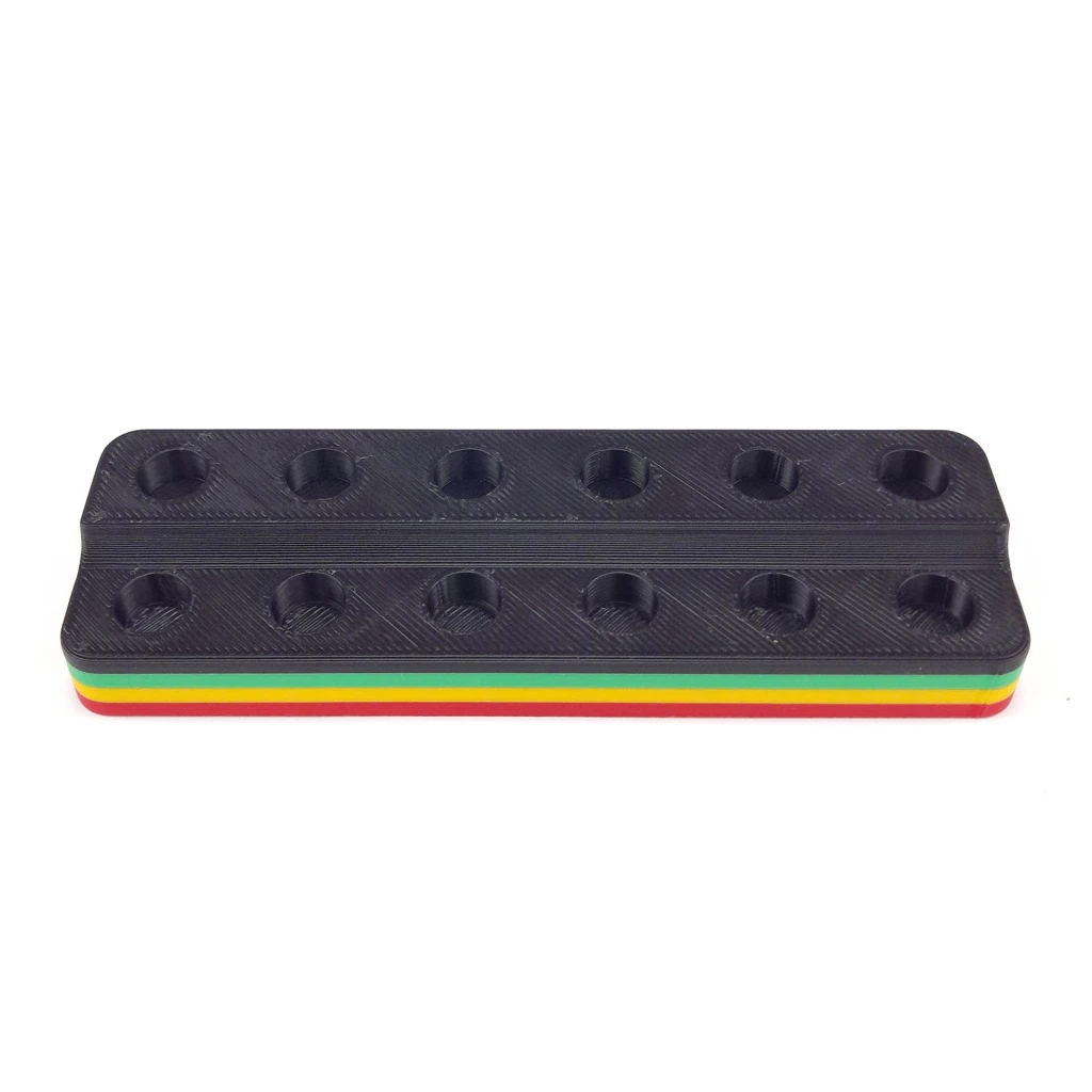 Expositor negro para filtros de cristal, con dos filas de huecos circulares y franjas verde, amarilla y roja en la base.