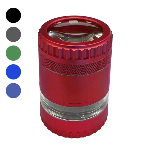 Grinder rojo cilíndrico con lupa en la tapa, bordes estriados y sección transparente, junto a cinco muestras de otros colores.