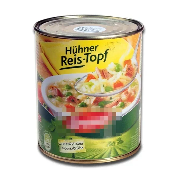 Bote de ocultación con apariencia de conserva, tapa metálica y etiqueta de arroz con pollo «Hühner Reis-Topf», con una zona pixelada.