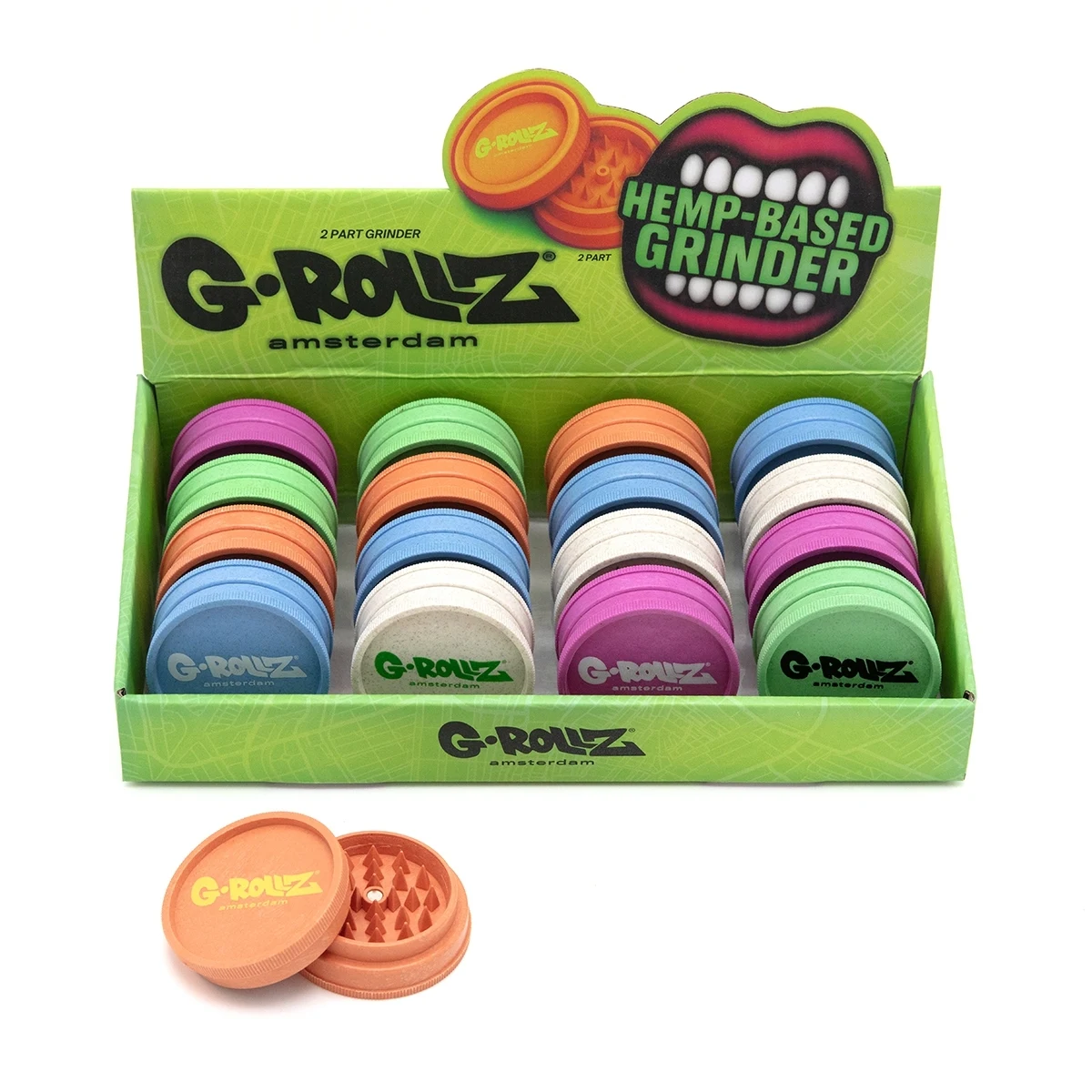 Expositor verde de grinders G-Rollz en varios colores, con un modelo naranja abierto delante que muestra sus dientes interiores.