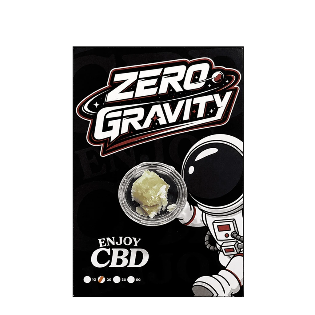 CBD Hash Enjoy Zero Gravity en recipiente abierto, con contenido amarillento sobre fondo negro con un astronauta y el texto «Zero Gravity».