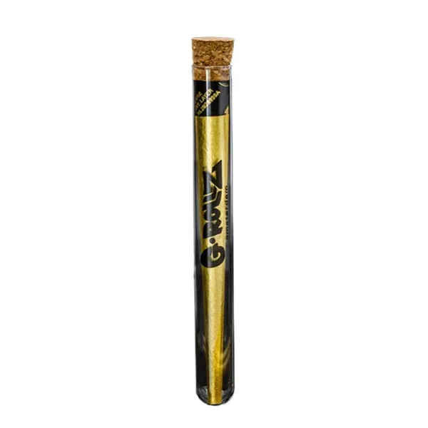 Cono dorado G-Rollz Gold King Size dentro de un tubo transparente vertical con tapón de corcho y letras negras.