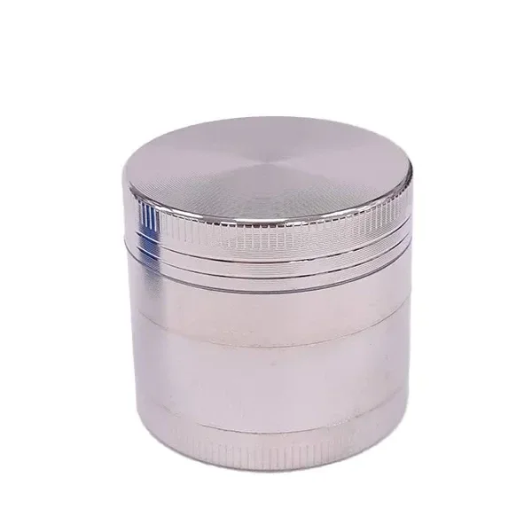 Grinder polinizador Silver cerrado, de forma cilíndrica y acabado plateado, con varias secciones y bordes estriados.