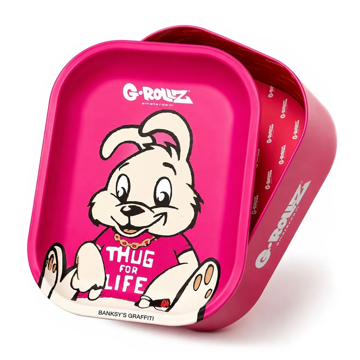 Bandeja y caja rosa Thug For Life, con la caja abierta detrás y un conejo dibujado en la bandeja que viste una camiseta con ese texto.