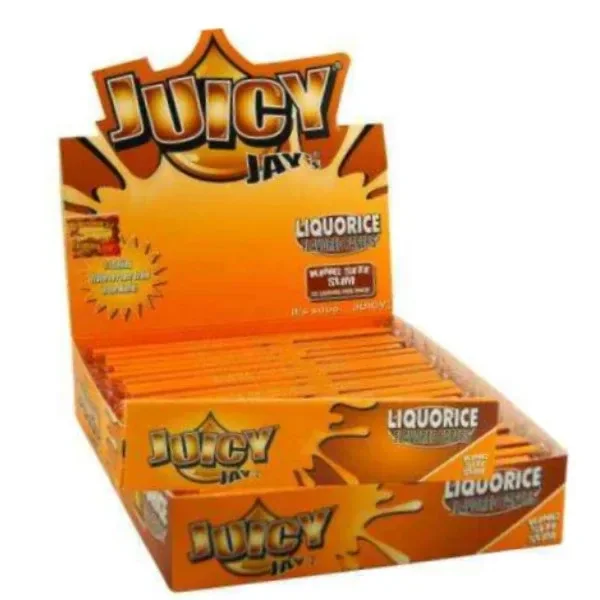 Expositor naranja abierto de papel Juicy Jay's King Size Regaliz, con varios libritos alineados y el rótulo «Liquorice».