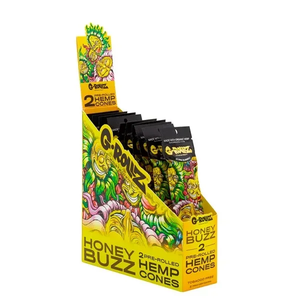 Expositor amarillo de conos G-Rollz Honey Buzz con varios sobres negros y dibujos multicolores en el embalaje.