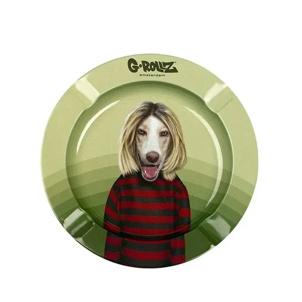 Cenicero redondo verde G-Rollz con muescas en el borde y un perro ilustrado con melena rubia y jersey de rayas rojas y negras.