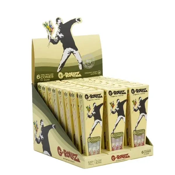 Expositor de conos G-Rollz con varias cajas amarillas y la silueta de una persona lanzando un ramo de flores.