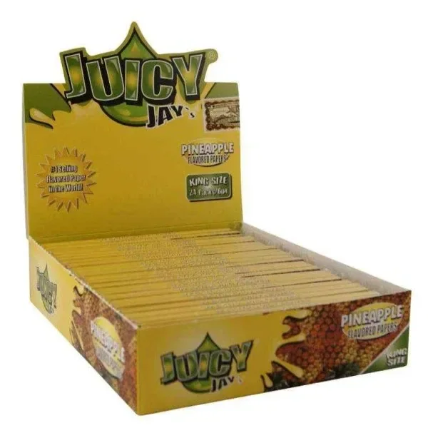 Expositor abierto de papel Juicy Jay's King Size Piña, amarillo, con varias unidades alineadas e ilustraciones de piña en el embalaje.