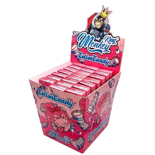 Expositor rosa de papel Monkey King Cotton Candy con estuches alineados y dibujos de monos, dulces y un mono coronado en la cabecera.