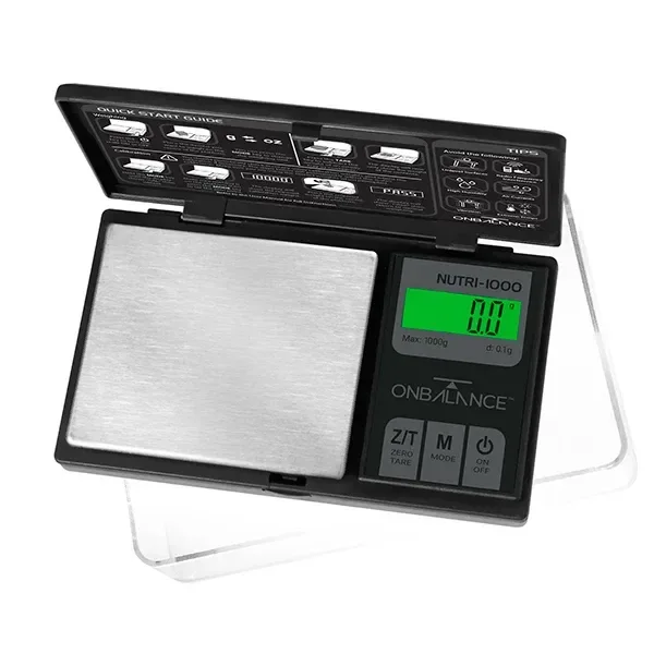 Báscula digital On Balance NUTRI-1000 abierta, con plataforma plateada, pantalla verde que marca 0,0 y botones de tara, modo y encendido.