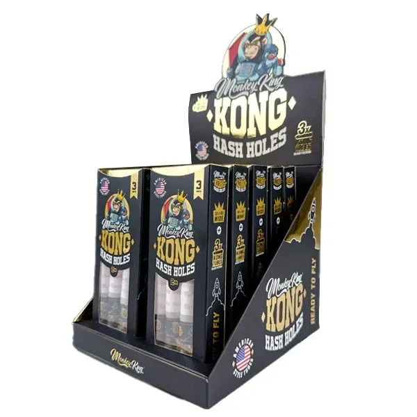 Expositor negro y dorado de conos Monkey King Kong Hash Holes, con varias cajas verticales y ventanas que muestran los conos.