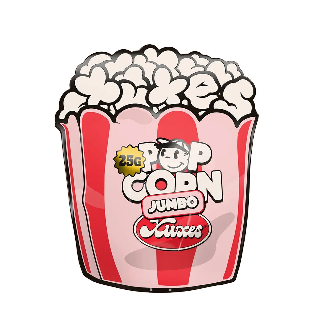 Envase de Poppy Xuxes con forma de caja de palomitas, franjas rosas y rojas y rótulos «Pop Corn», «Jumbo» y «25G».