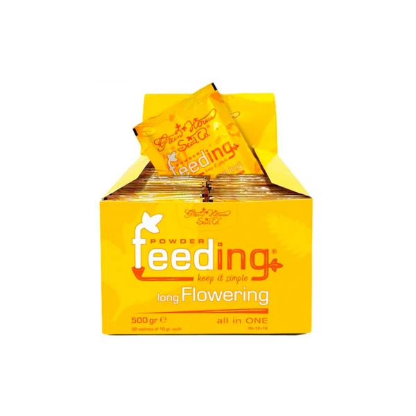 Caja expositora amarilla de fertilizante Green House Powder Feeding Long Flowering, abierta y con sobres en su interior.