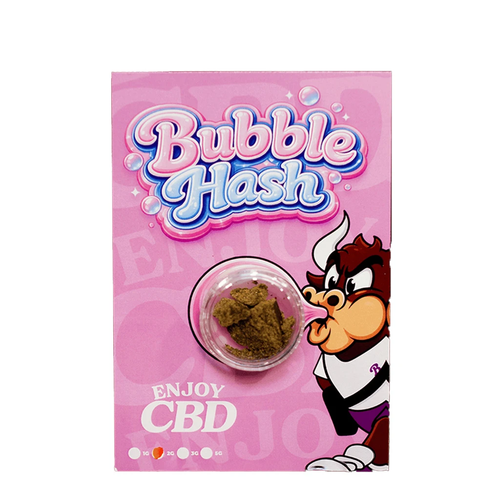 Envase rosa de CBD Hash Enjoy Bubble con recipiente transparente de fragmentos marrones y un toro de dibujos junto al texto «Bubble Hash».