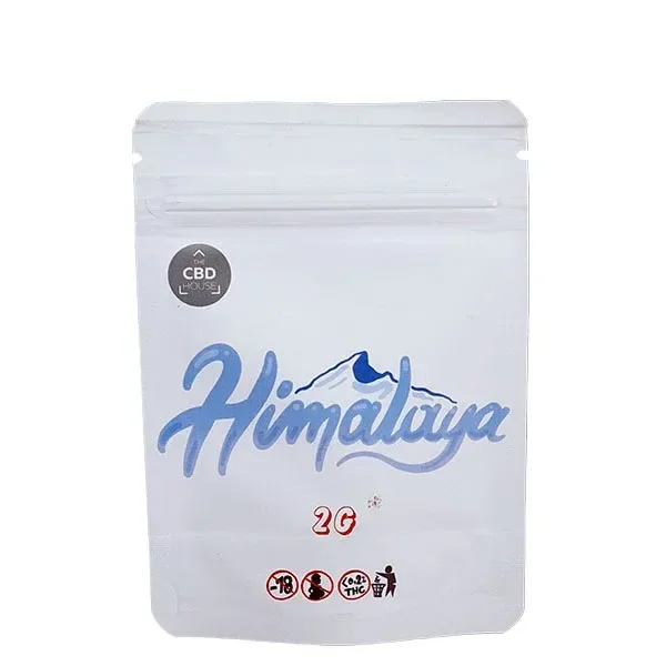 Bolsa blanca con cierre resellable de CBD House Himalaya, con nombre azul, dibujo de montaña e indicación de 2 g.
