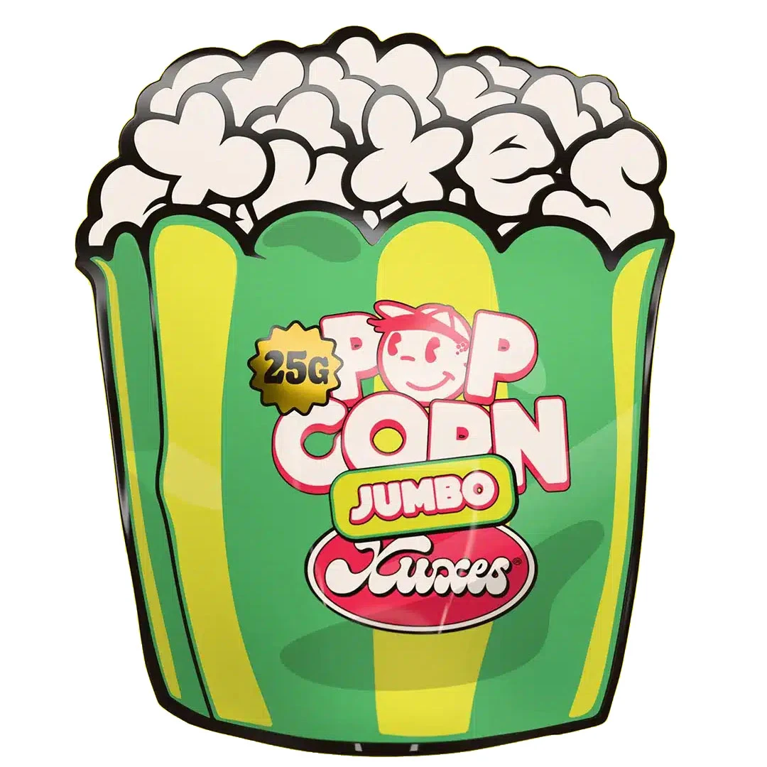 Envase Xuxes Pop Corn Jumbo verde y amarillo, con silueta de caja de palomitas y las inscripciones Pop Corn, Jumbo y 25G.