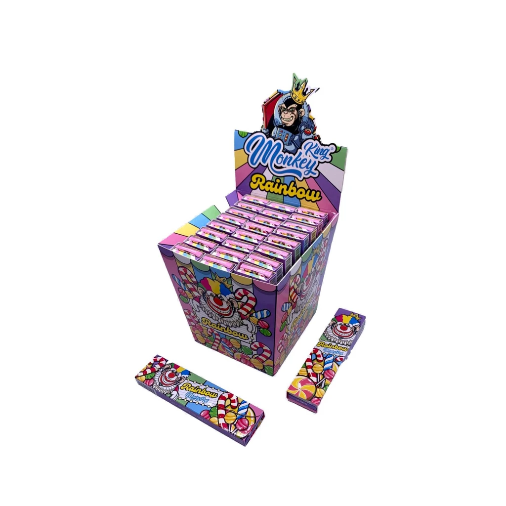 Expositor de papel Monkey King Rainbow con librillos multicolores y dibujos de payasos, y dos librillos delante sobre fondo blanco.