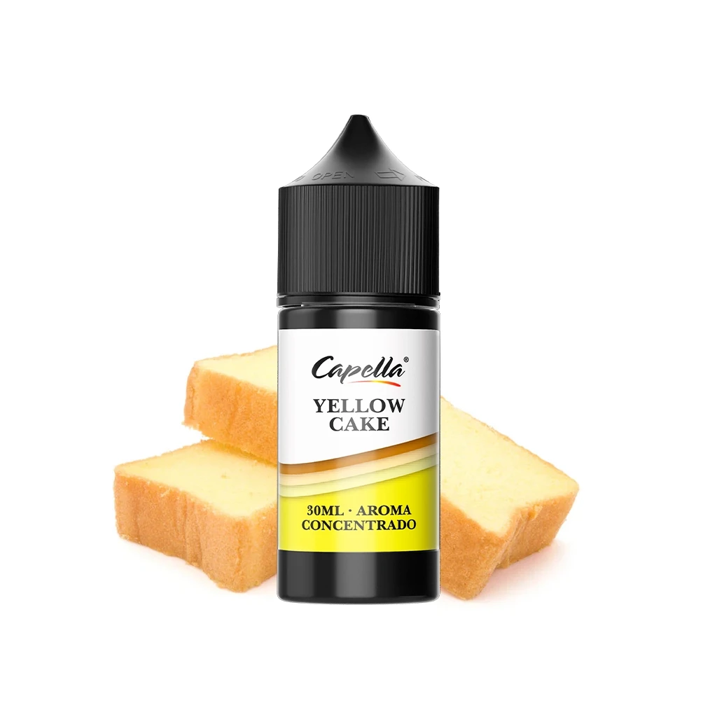 Frasco de aroma Capella Yellow Cake con tapón negro y etiqueta blanca y amarilla, delante de varias rebanadas de bizcocho.