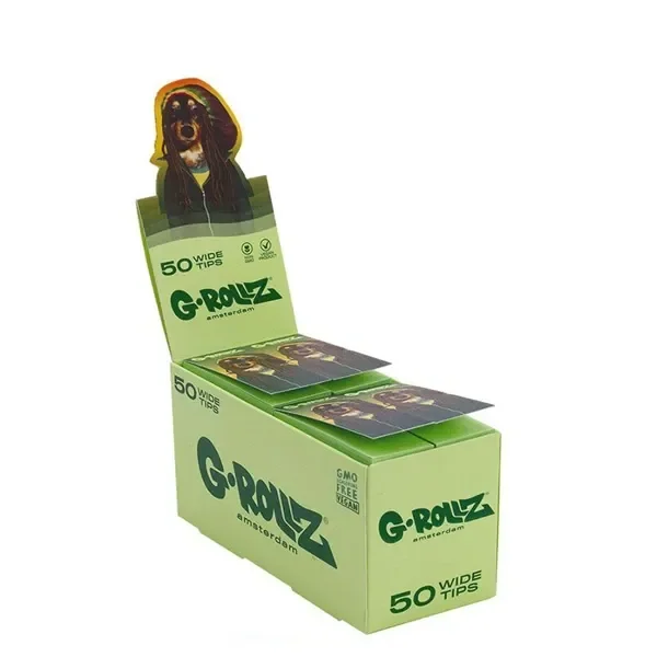 Expositor verde de filtros G-Rollz Tips Reggae Pets con varios libritos, ilustración de un perro y texto «50 Wide Tips».