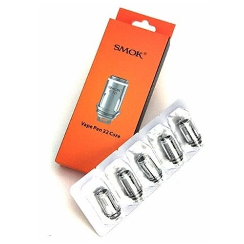 Caja naranja SMOK Vape Pen 22 Core junto a un blíster con cinco resistencias plateadas, dispuestos en diagonal sobre fondo blanco.