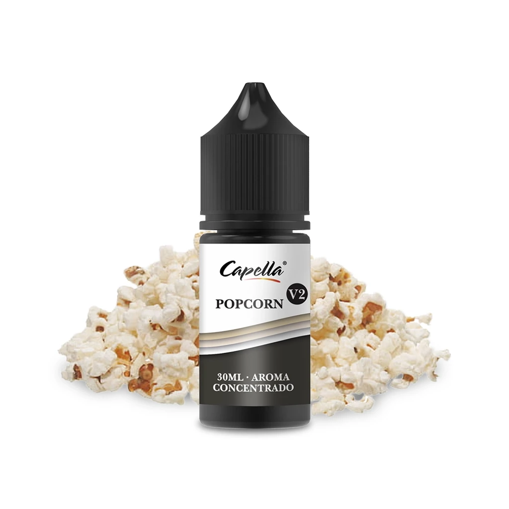 Frasco de Capella Popcorn V2 con tapón negro y etiqueta de aroma concentrado de 30 ml, delante de un montón de palomitas.