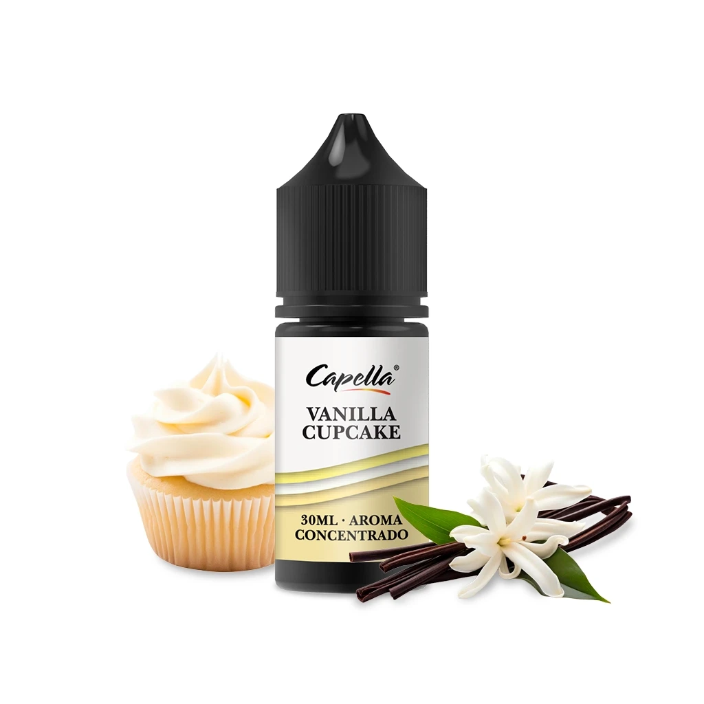 Frasco Capella Vanilla Cupcake con tapón negro y etiqueta de 30 ml de aroma concentrado, junto a un cupcake, flores y vainas de vainilla.