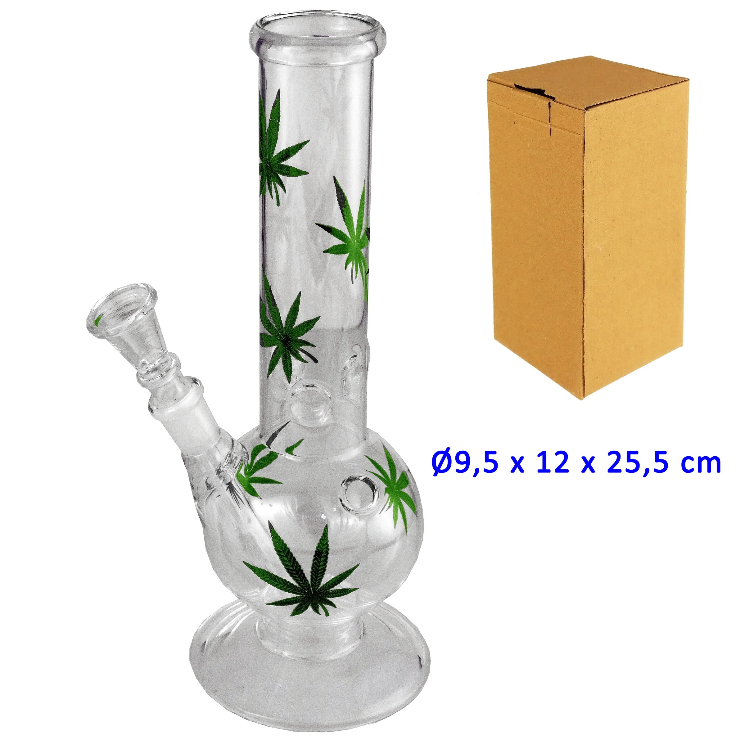 Bong de cristal transparente con base redonda, cámara esférica, hojas verdes decorativas y cazoleta lateral, junto a una caja marrón.