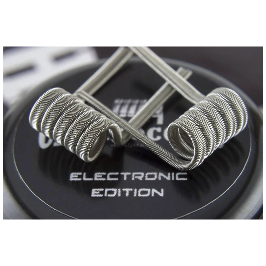 Primer plano de dos resistencias Charro Coils con alambre ondulado y patillas cruzadas sobre una base negra rotulada Electronic Edition.
